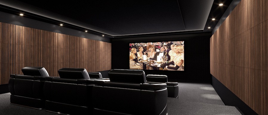 A home theater with wooden acoustic panels on the wall. 